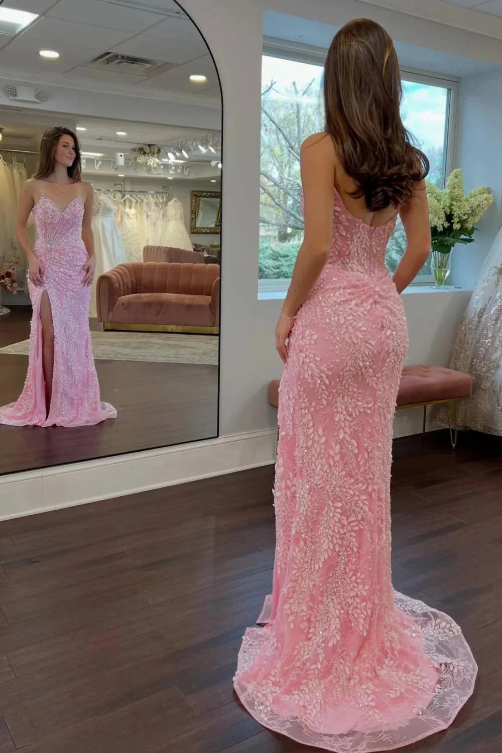 Rear view of Vedress strapless low‑back lace formal gown with long train