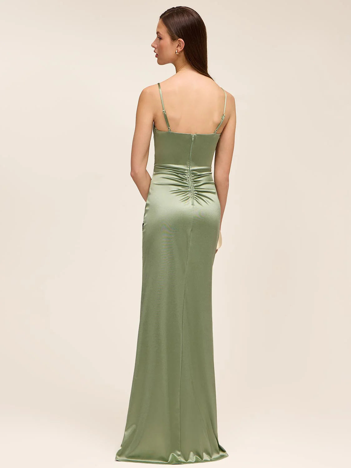 Back view of sage green satin formal dress with spaghetti straps, low back, zipper closure, ruched back detail, and floor-length sheath skirt by VEDRESS