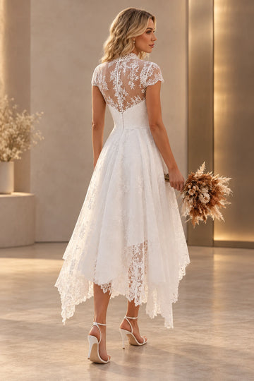Back view of Vedress lace midi wedding dress showing a high sheer back, center zipper and flowing handkerchief skirt with scalloped edges.
