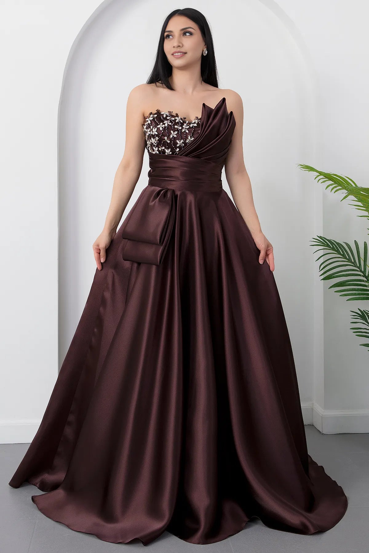 Statement A-line strapless satin prom gown with beaded applique bodice and sculpted pleated detail