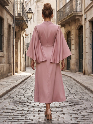 Model wearing vedress dusty pink formal midi dress solid back invisible zip cape sleeve rear view