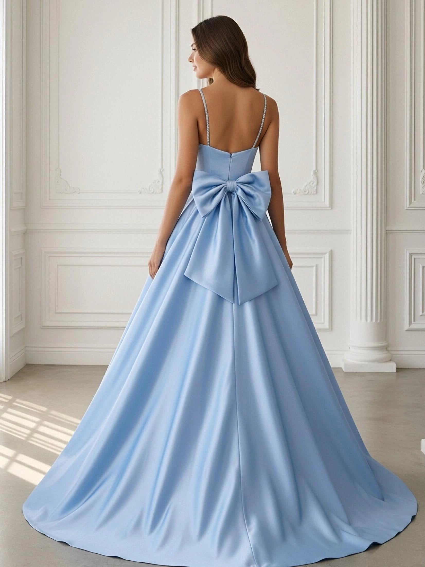 Model wearing vedress light blue satin prom dress oversized satin bow back rear view