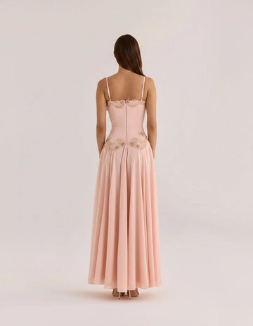 Blush pink floor-length wedding guest dress with spaghetti straps and zipper back