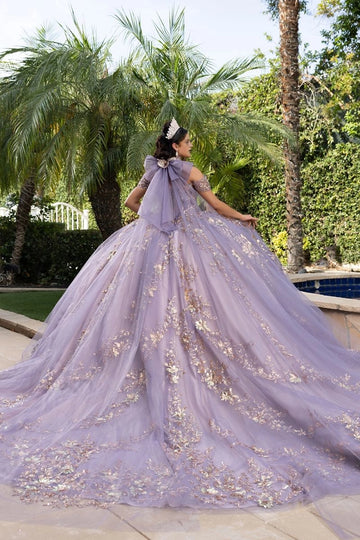 Back view of lavender Quinceañera dress with oversized tulle bow, floral appliqués and long sweeping train
