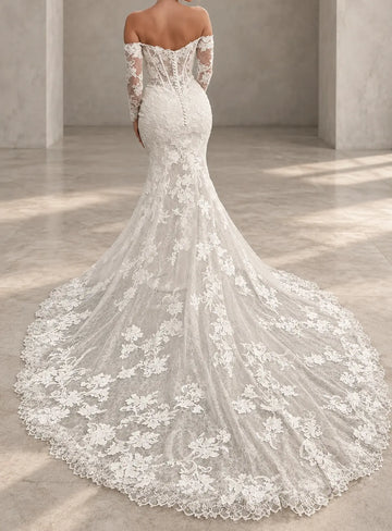 Vedress mermaid wedding dress with an illusion lace back, visible boning, covered buttons and a long scalloped lace train, back view