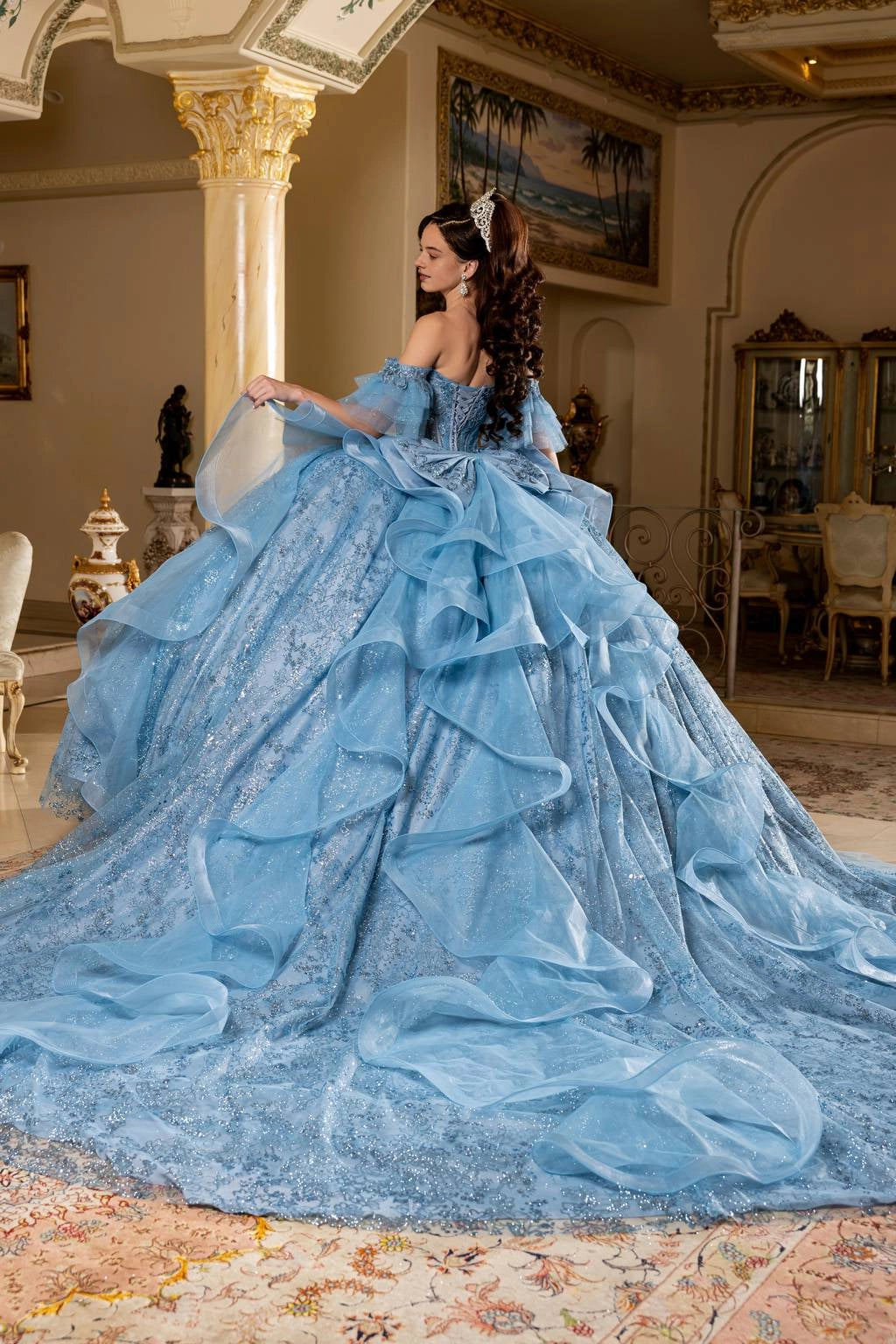 blue corset back Quinceañera dress with cascading ruffles and long train