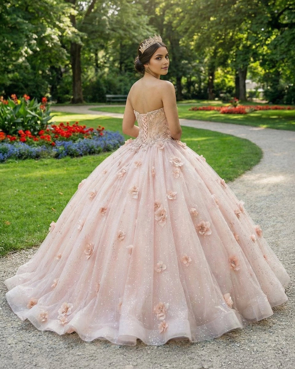 Vedress blush quinceanera ballgown back view, strapless lace up corset back, glitter tulle floor length skirt with 3D flowers