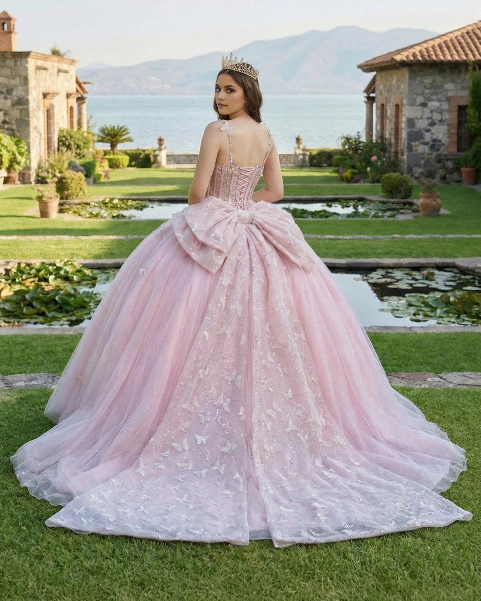 Vedress light pink quinceanera ballgown back view, lace up corset back with big bow, glitter tulle sweep train decorated with 3D butterflies