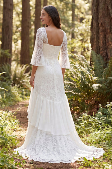 Vedress low square back lace bridal gown bell sleeve layered ruffle train forest backdrop