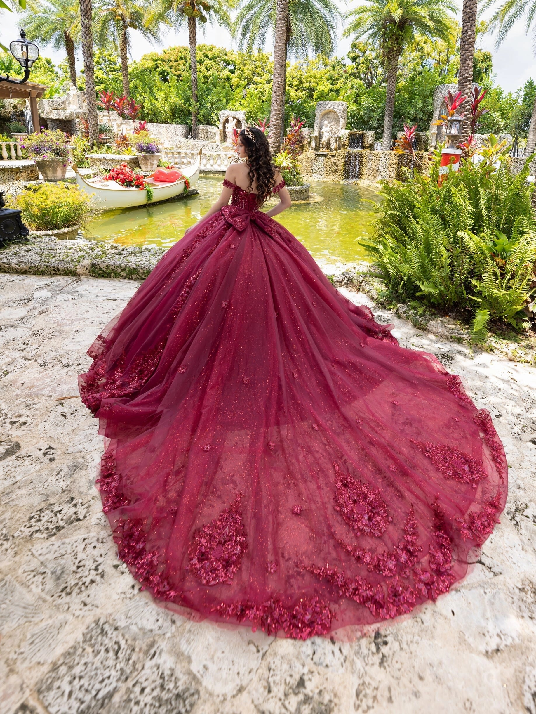Vedress burgundy quinceanera dress lace‑up corset back large satin bow cathedral‑train floral ballgown back view