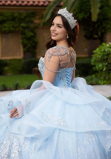 Back view Vedress light blue quinceanera gown corset lace-up back crystal chain cape glitter ruffle ball gown