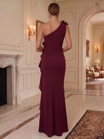 Vedress floor-length formal gown with asymmetrical shoulder neckline, 3D floral shoulder detail, fitted back, center zipper, and elegant sheath skirt, back view