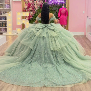 Vedress sage green quinceanera ball gown corset back cathedral train oversized tulle bow beaded scallop pattern off-shoulder back view