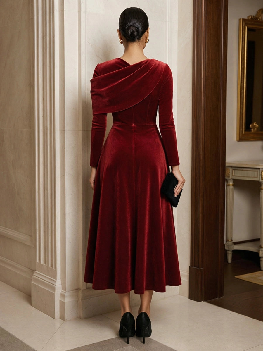 Model wearing vedress burgundy velvet midi dress v back invisible zip asymmetric drape rear view