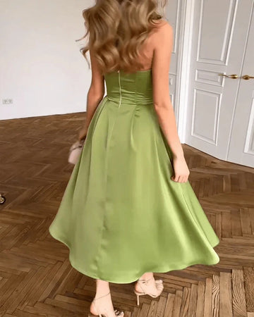 Back view of Vedress olive green satin wedding guest dress showing a clean fitted back and center-back zipper.