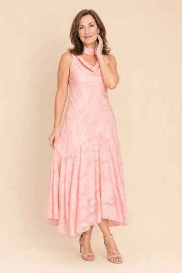 Vedress blush pink jacquard a‑line midi mother of the bride dress,front view sleeveless cowl neck,asymmetrical ruffled hem,textured floral fabric,beige studio background