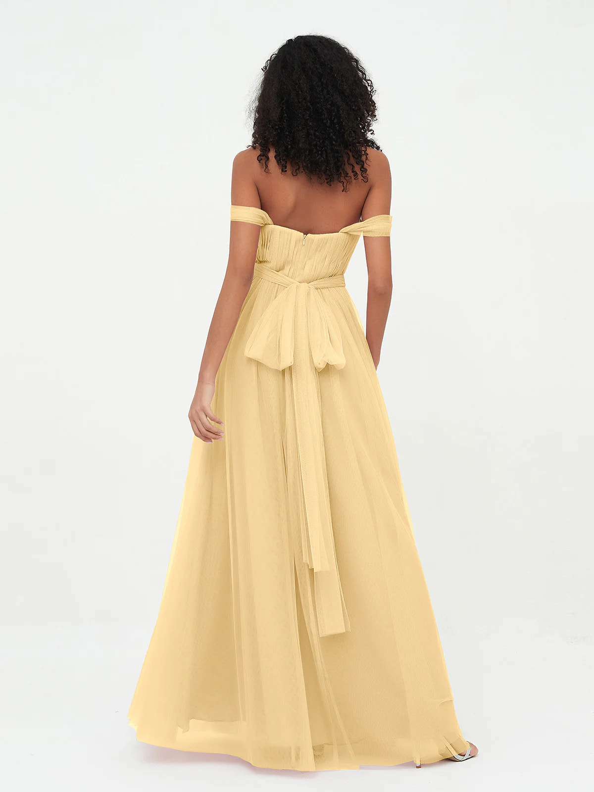 Back view of gold off-shoulder tulle bridesmaid dress with low back, zipper closure, tie-waist bow, and floor-length A-line skirt by Vedress