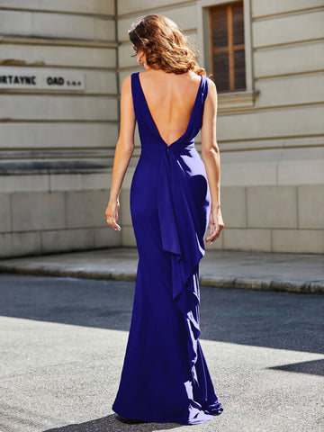 Back view of royal blue evening dress with deep V open back, concealed zipper, draped back detail, and floor-length skirt by Vedress