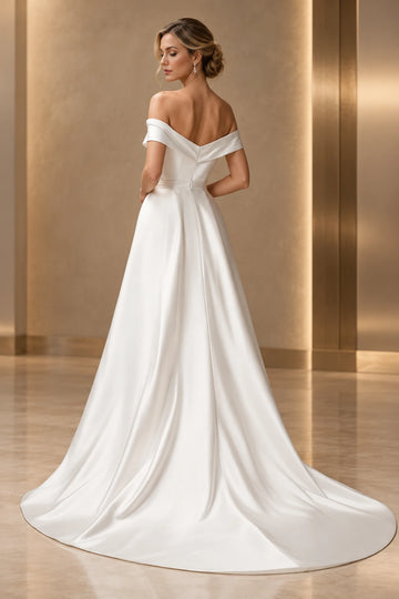 Back view of Vedress satin wedding dress featuring a folded V-back neckline, fitted bodice, center-back zipper and sweeping overskirt train.