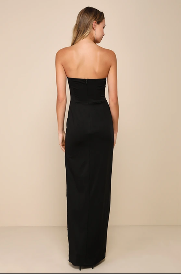 Back view of black strapless formal dress with open-back effect, center zipper closure, slim column silhouette, and floor length design by VEDRESS