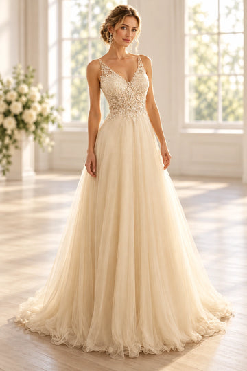 Front view of a Vedress ivory tulle A-line wedding dress with a floral beaded V-neck bodice, sheer shoulder straps and a flowing skirt