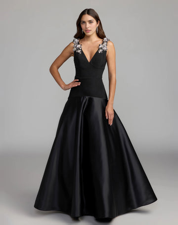 Black A-line wedding guest dress with a plunging V-neckline, silver floral embellished straps, fitted waist, and floor-length skirt by Vedress.