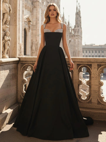 Black sweetheart A-line prom dress with crystal beaded straps and full floor length skirt front view