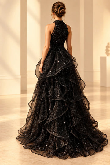Back view of a Vedress black glitter tulle wedding dress with a covered halter bodice, layered cascading ruffles and a sweep train
