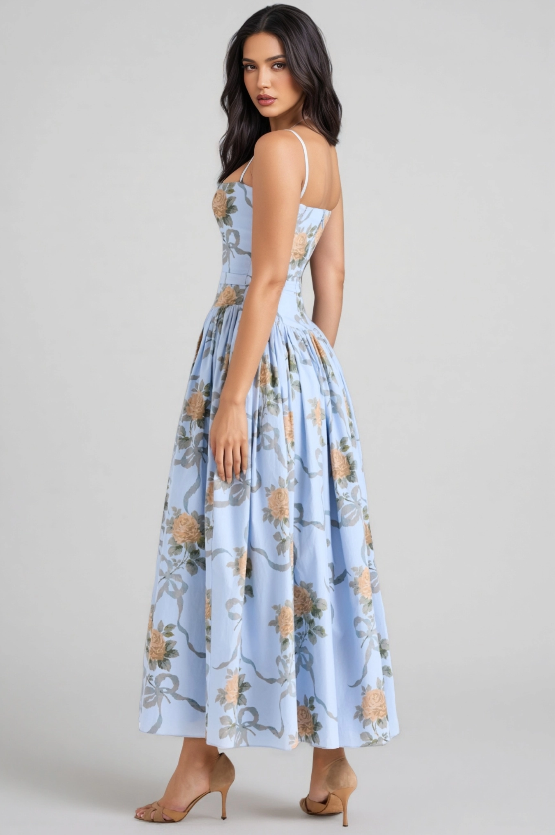 Back view of light blue floral midi dress with spaghetti straps, fitted bodice, A-line gathered skirt, and romantic floral print by VEDRESS