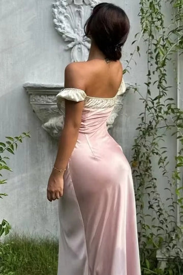 Blush off-shoulder satin wedding guest dress with puff sleeves and floor-length sheath silhouette by Vedress