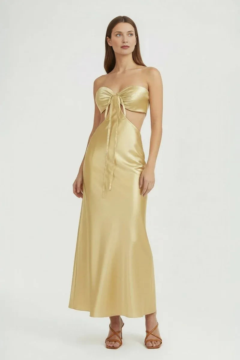 Strapless satin maxi wedding guest dress with front bow tie, side waist cutouts, and sleek sheath silhouette by Vedress