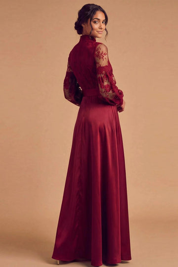 Back view of burgundy mother of the bride gown with a high lace-covered back, sheer floral lace sleeves, fitted waistband, and flowing satin-look A-line skirt.