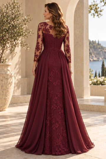 Back view of burgundy mother of the bride gown featuring sheer floral lace illusion back, center zipper, lace fitted skirt and flowing side panels