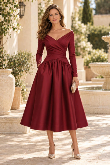 Burgundy A-line mother of the bride dress with off-shoulder sweetheart neckline, long sleeves, ruched bodice and tea-length gathered skirt
