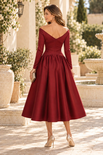Back view of burgundy mother of the bride dress featuring V-shaped off-shoulder back, center zipper, fitted waist and flowing tea-length A-line skirt