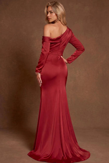 Back view of burgundy mermaid evening gown featuring asymmetric draped neckline, fitted long sleeves, tailored waist, and flowing train by Vedress.