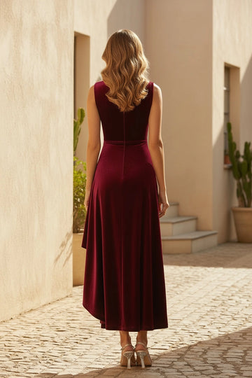 Back view of burgundy velvet mother of the bride dress featuring covered back, center zipper and softly flared high-low hem