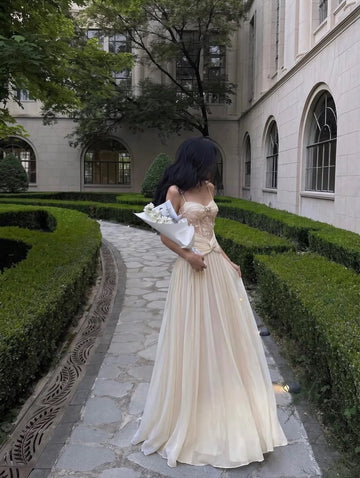 Champagne A-line prom dress with corset bodice and flowing pleated chiffon skirt by Vedress