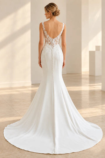 Vedress mermaid wedding dress back view showing a low open back, sheer floral lace panels, covered buttons and a sweeping crepe train.