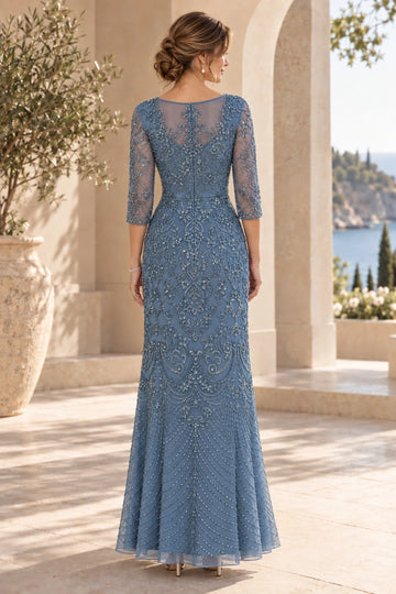 Back view of dusty blue mother of the bride gown with sheer illusion back, beaded floral embroidery, three-quarter sleeves and floor-length column skirt
