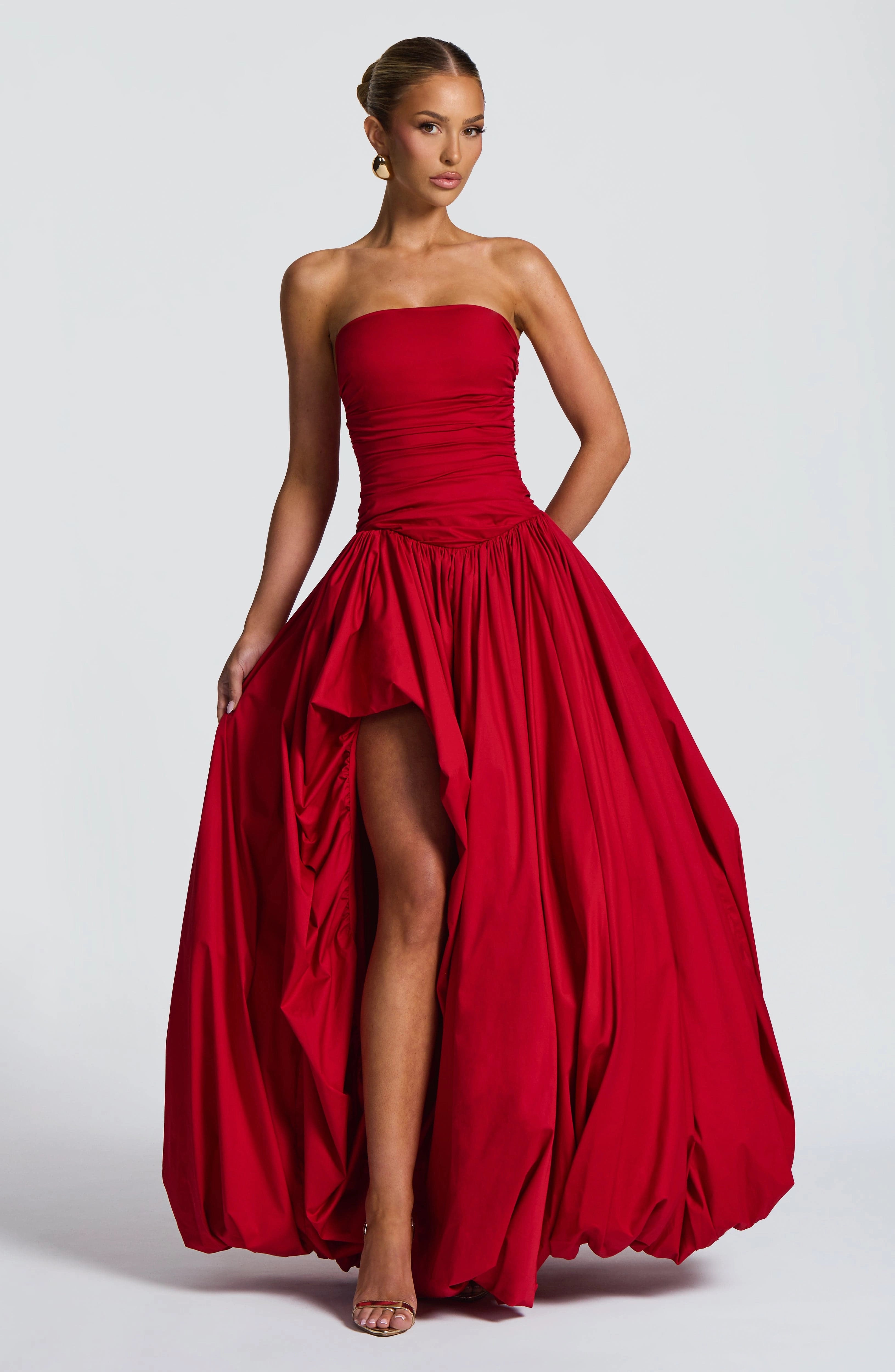 Red A-line prom dress with spaghetti straps, fitted bodice and flowing full-length skirt front view