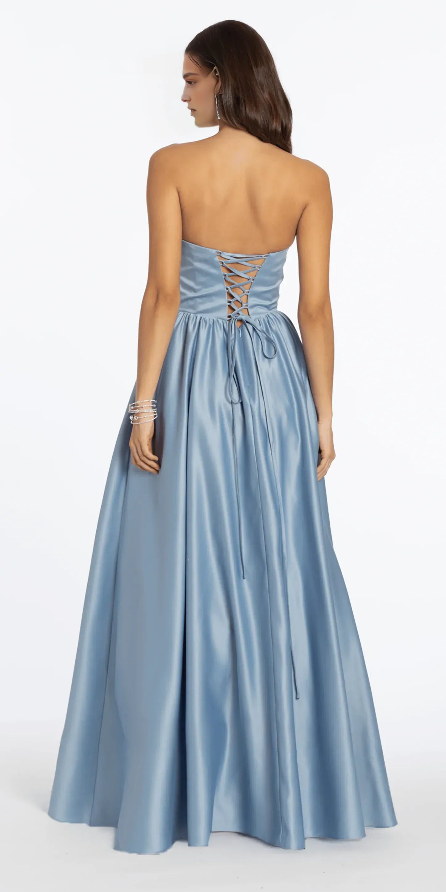 Back view of light blue satin ball gown with lace-up back, strapless bodice, full floor length skirt, and elegant formal gown design by VEDRESS