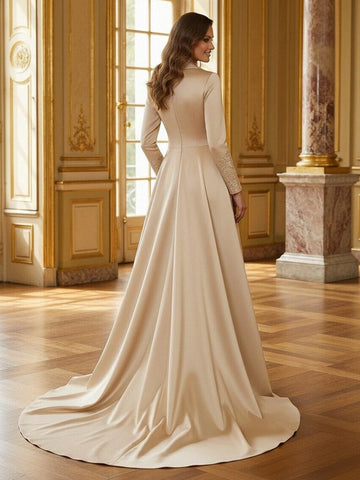 Back view of a satin Mother of the Bride dress with long sleeves, a fitted bodice, flowing full skirt, and sweeping train.