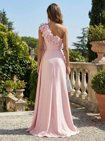Vedress floor-length evening gown with asymmetrical back neckline, floral shoulder appliques, fitted waist, and flowing skirt, back view