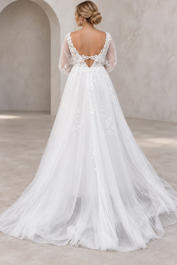 Back view of long-sleeve tulle wedding dress with floral lace keyhole back and sweeping train