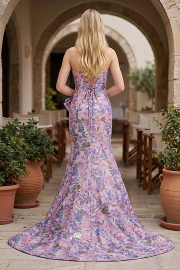 Back view of a floral prom dress featuring crisscross lace-up closure and sweeping train