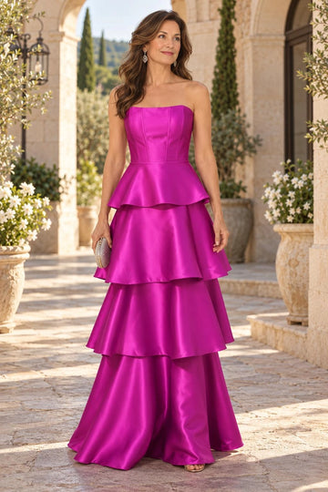 Fuchsia strapless A-line mother of the bride dress with structured seamed bodice, satin-like finish, defined waist and cascading floor-length tiered skirt, front view.