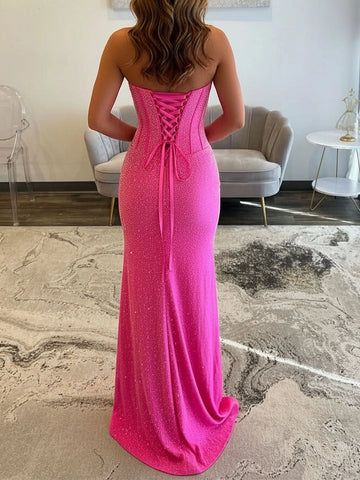 Hot pink prom dress with lace-up corset back and sleek sparkling floor length skirt back view