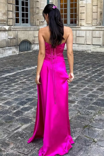 Hot pink long prom dress with lace-up back and flowing skirt