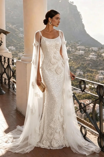 Ivory scoop neck sheath evening dress with floral appliqués shimmering details and long sheer cape sleeves